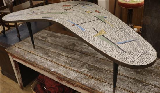 A 1960s mosaic topped boomerang shaped coffee table, W.170cm